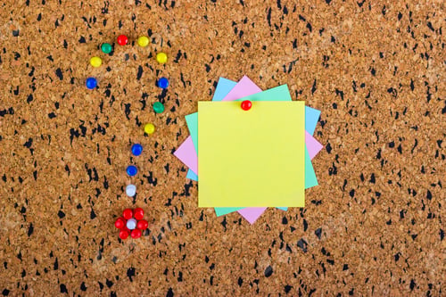 Preview: colorful sticky notes on cork bulletin board. Question mark made of pushpins