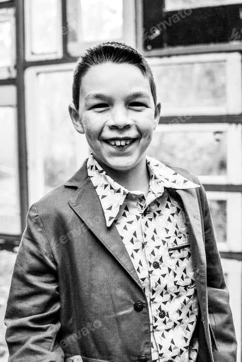 Preview: Génération Z boy wearing a costume and smiling portrait emotion proud