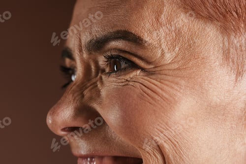 Preview: Senior shirtless woman smiling while posing on camera