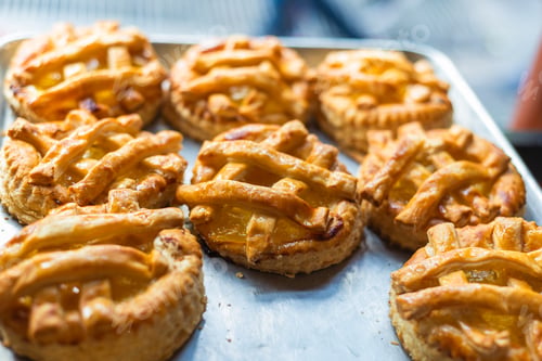Preview: Small apple pies in a bakery.