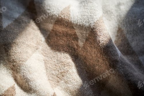 Preview: The texture of a warm sweater with a beige pattern.