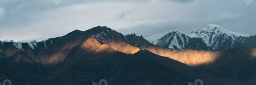 Preview: Majestic snow-capped Himalayan mountains near Leh under clear blue sky, natural landscape
