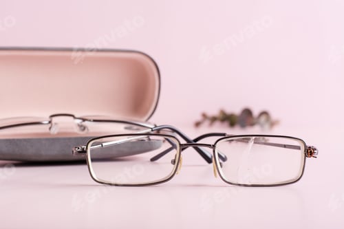 Preview: The concept of correct storage - broken glasses on the background of a hard case with glasses