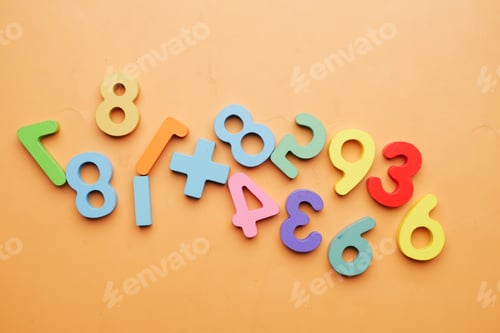Preview: colorful plastic letters on white background, close up