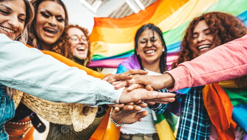 Preview: Lgbt group of people stacking hands outside