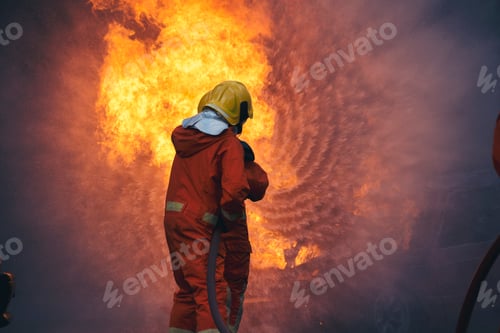 Preview: Firefighter Rescue training in fire fighting extinguisher. Firefighter fighting with flame fire