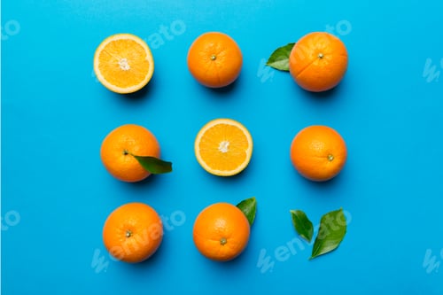 Preview: Fruit pattern of fresh orange slices on colored background. Top view. Copy Space