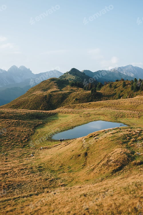 Preview: Beautiful shot of a small lake on a mountainous landscape