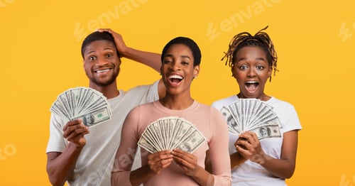 Preview: Emotional black people with cash celebrating success on yellow