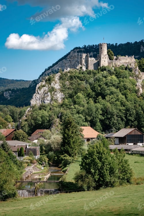 Preview: romantic castle on top of a hill in a mountainous valley