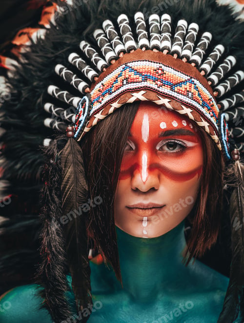 Preview: Close up shot of wild woman with feather headwear