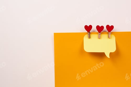 Preview: a note on a yellow piece of paper and a wooden clothespin with a heart Creativity Copy Space