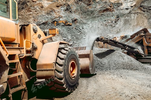 Industrial Machinery Excavating Materials at a Quarry Site