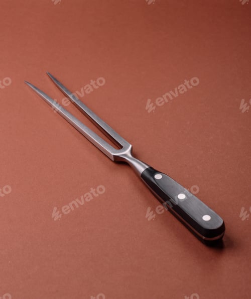 Preview: Empty meat or steak fork with vegetables, spices and other ingredients. Meat fork