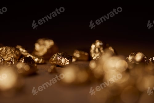 Preview: selective focus of golden stone on black background