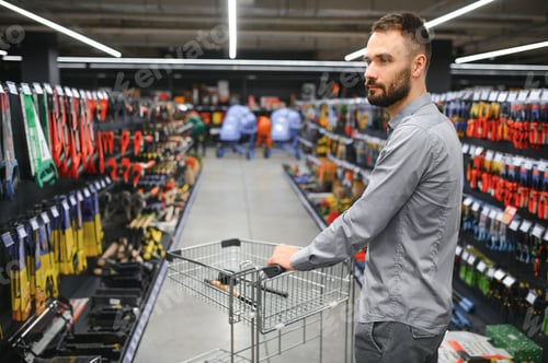 Preview: male builder in a hardware store