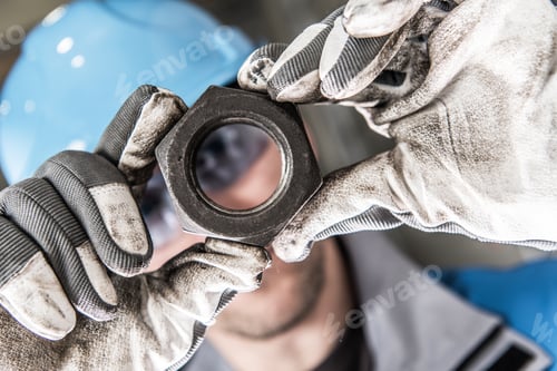 Preview: Metal Nut in Worker Hands