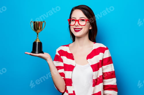 Preview: young smiling woman with cup trophy