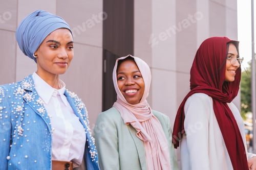 Preview: Beautiful muslim girl wearing hijab bonding outdoors