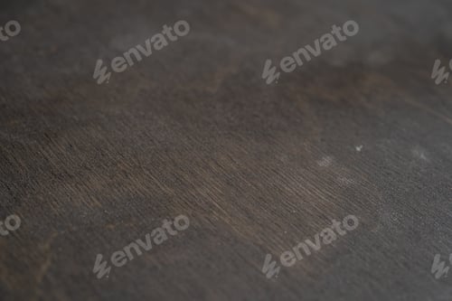 Preview: A sheet of plywood covered with dark oil. close-up texture.