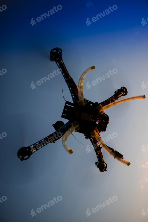 Preview: Quadrocopter in flight at sunset