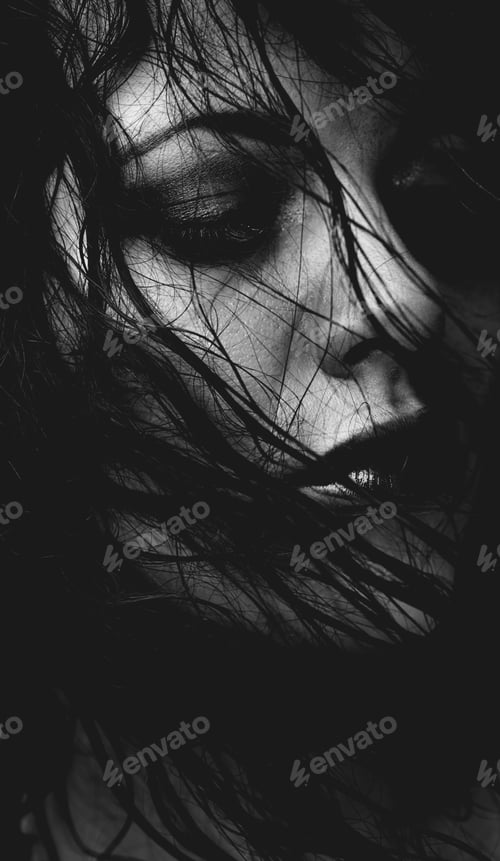Preview: Dark and sensual. Cropped black and white image of a gorgeous young woman with hair in her face.