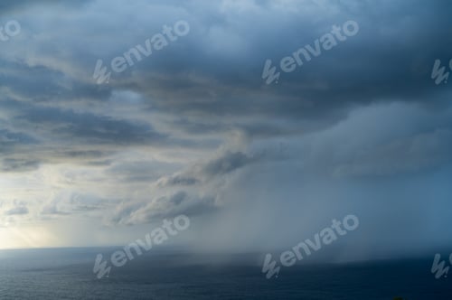 Preview: Majestic seascape under thick cloudy sky at twilight