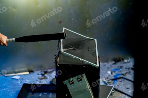 Preview: broken discarded computer monitors and televisions broken equipment disposal hit with a baseball bat