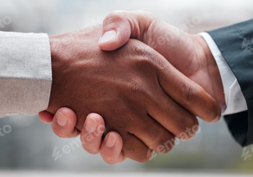 Preview: Cropped shot of two unrecognizable businessmen shaking hands while standing in their office