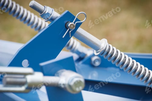 Preview: Hard spring made of steel. Part of big industrial or agricultural machine