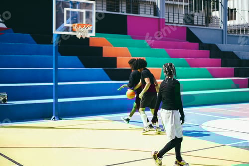 Preview: African friends playing basketball outdoor - Focus on girl head