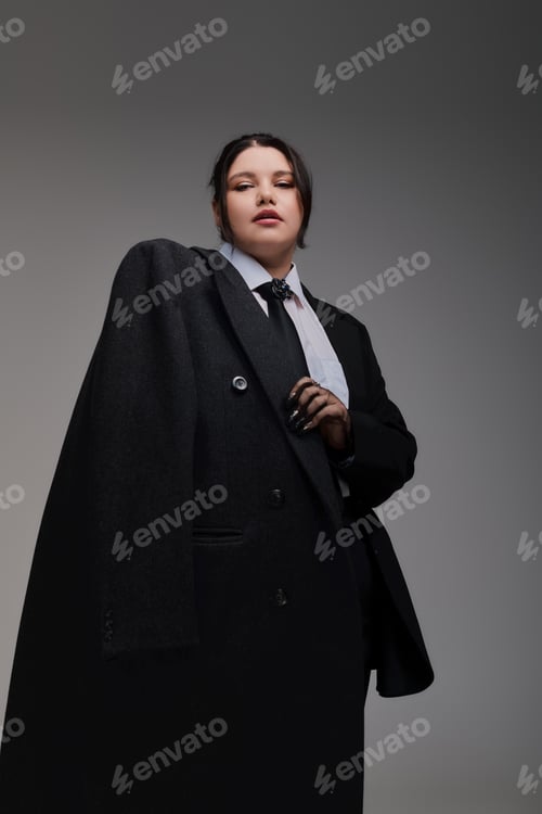 Preview: Stylish plus size woman exudes confidence in oversized fashion statement