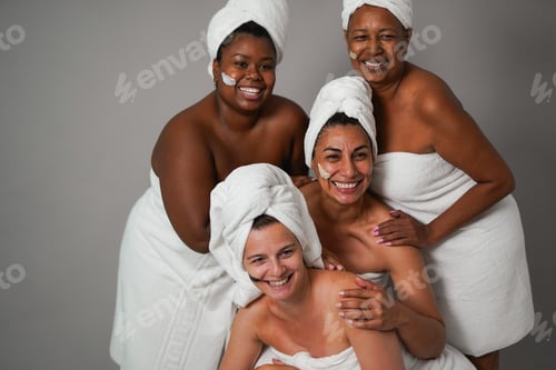 Preview: Multiracial women posing in front of camera during skin care treatment