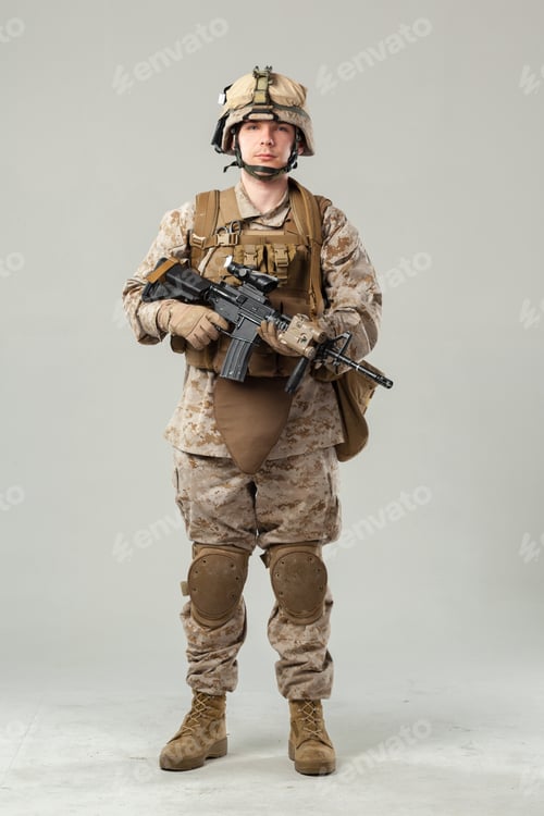 Preview: Soldier stands ready with rifle in military uniform inside studio setting