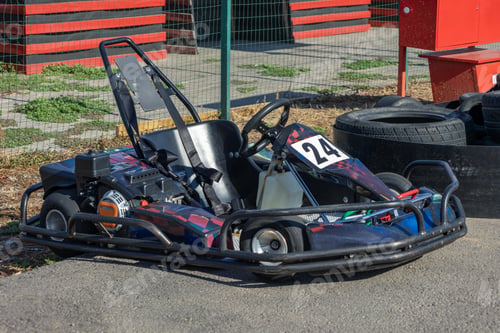 Preview: Racing go kart parked on asphalt awaits next driver