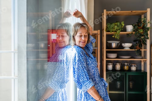 Preview: Beautiful mature senior woman at home