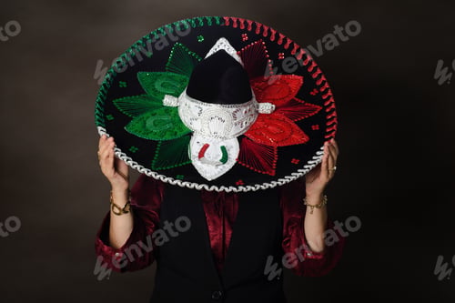 Preview: Studio portrait of person wearing charro hat.