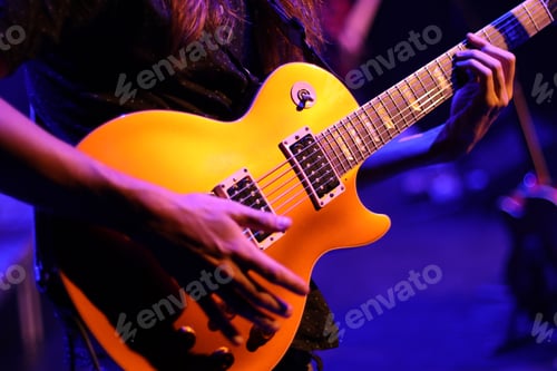 Preview: man playing guitar on the stage