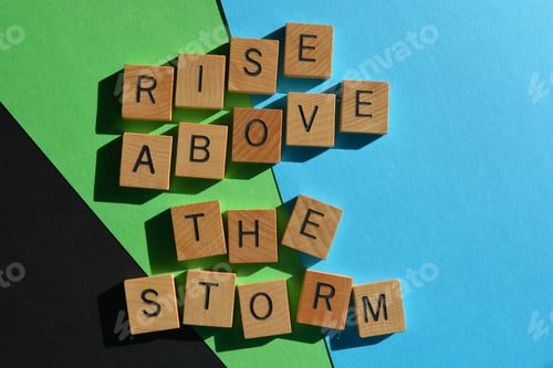 Preview: Rise above the storm, motivational words in wooden alphabet letters isolated on background