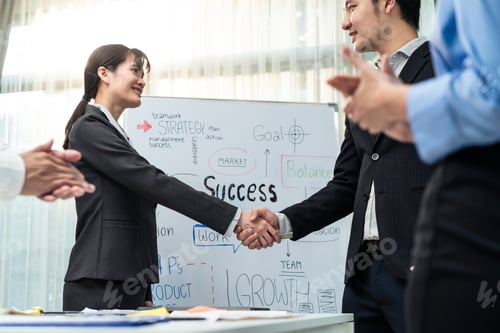 Preview: Asian businessman and woman handshake after negotiations for Business deal in meeting room.
