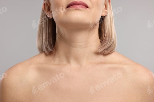 Preview: Woman with healthy skin on grey background, closeup