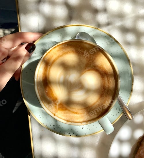 Latte with Latte Art on a Marble Table