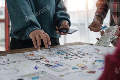 Preview: UX developer and ui designer brainstorming about mobile app interface wireframe design at modern