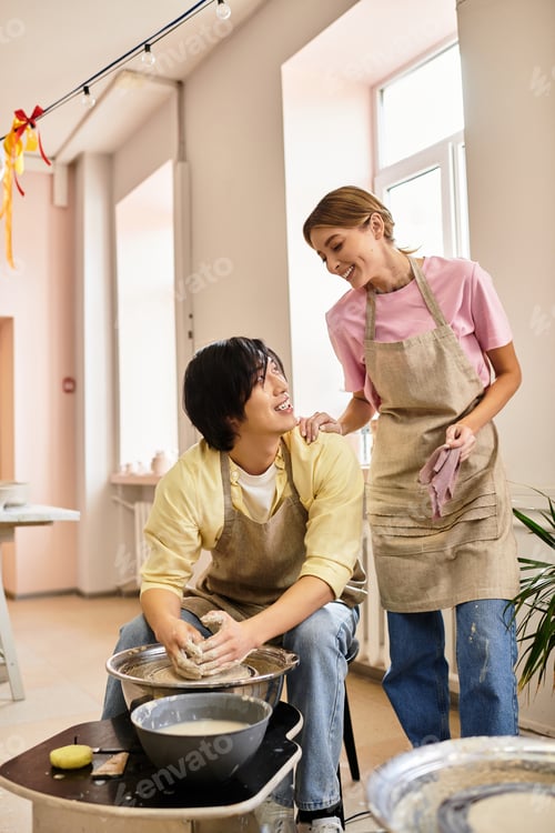 Preview: Young couple creates memories while crafting pottery together in a cozy art studio