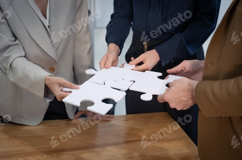 Preview: Close up group of business people hand holding white puzzle of four pieces, Business teamwork