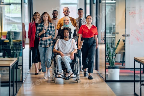 Preview: A diverse group of young business people congregates within a modern startup's glass-enclosed office