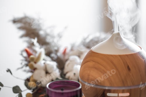 Preview: Modern oil aroma diffuser close up on a blurred background.