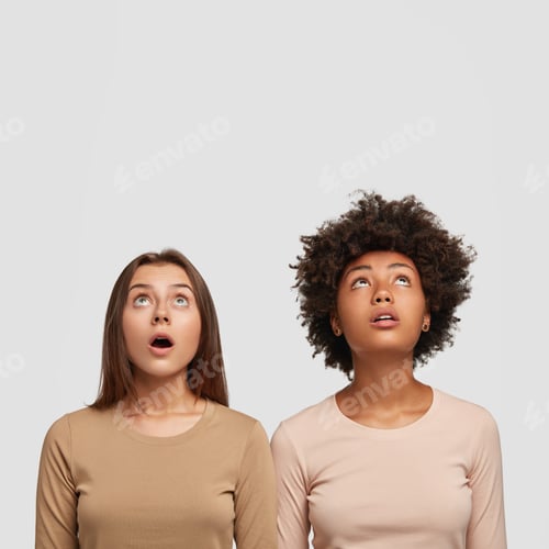 Preview: Indoor shot of surprised mixed race sister look upwards, open mouthes from surprisement, hear or see