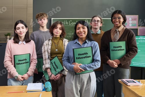 Preview: Group of Diverse Teenagers Standing Together Holding Health Education Folders
