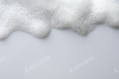Preview: Fluffy soap foam on white background, top view